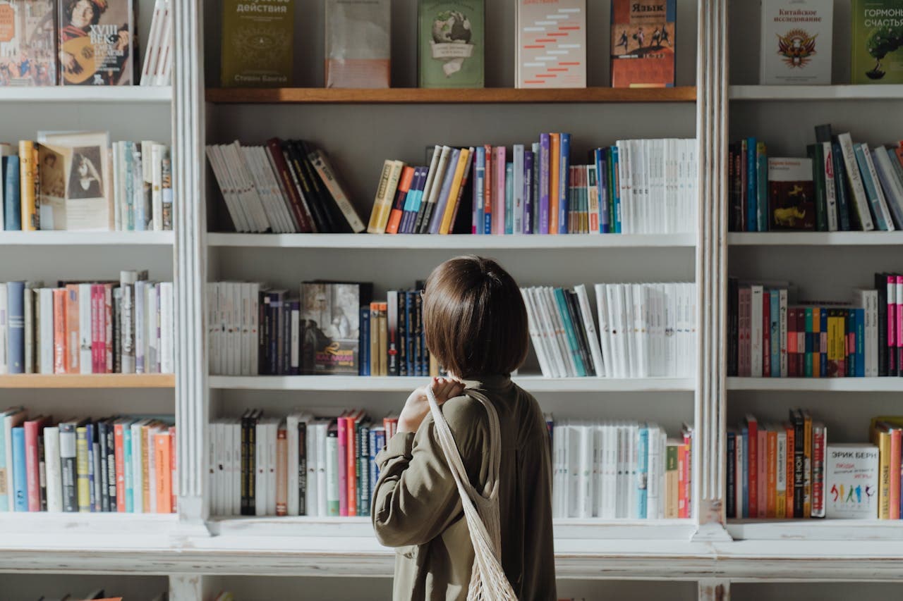 Women looking at bookshelf
